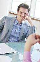 young business man alone in conference room photo