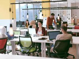 creative business people group as freelancers  in modern coworking open space office photo