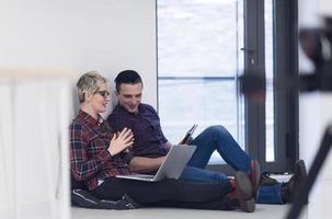 startup business, couple working on laptop computer at office photo