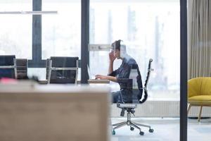 businessman working using a laptop in startup office photo
