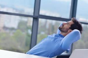 happy young business man at office photo