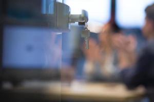 Open  glass door with keys photo