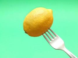 fresh lemon on fork photo