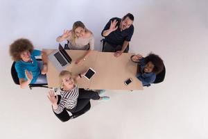 Multiethnic startup business team on meeting  top view photo