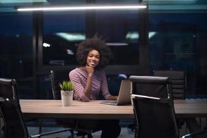 black businesswoman using a laptop in startup office photo