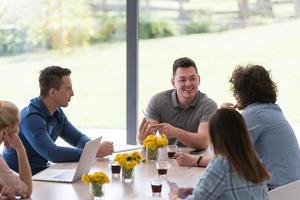 Startup Business Team At A Meeting at modern office building photo