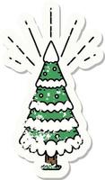 grunge sticker of tattoo style snow covered pine tree vector