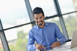 happy young business man at office photo