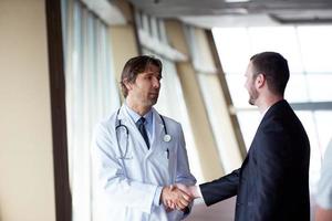 doctor handshake with a patient photo