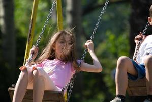 happy girl swinging photo