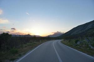 road through the green field photo