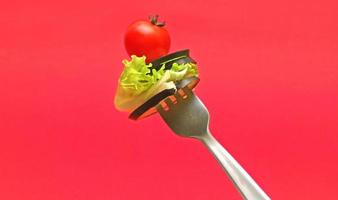 sliced vegetables on fork photo