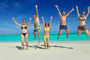 group of happy young people have fun on bach photo