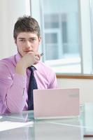 business man alone in conference room photo