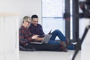 startup business, couple working on laptop computer at office photo