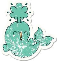 worn old sticker of a tattoo style happy squirting whale character vector