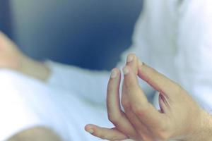 Close-up of man meditating on Yoga class. photo