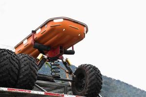 An orange lifeboat or rescue boat was stowed on the back of a handcart to help flood victims in the backcountry. photo