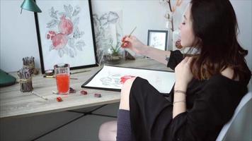 femmina artista fabbricazione un' acquerello pittura video