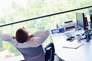 happy young business man at office photo