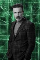 Black and white portrait of a stylish elegant senior businessman with a beard and casual business clothes against retro colorful pattern design background gesturing with hands photo