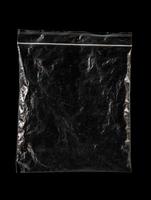 transparent plastic bag with zipper on black background for mockups photo