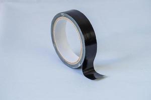 black duct tape roll isolated on white background photo