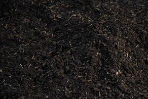 mounds of fertile dark soil for the environment. background for farmer and ecology theme design photo