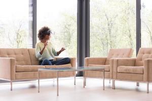 black woman using VR headset glasses of virtual reality photo