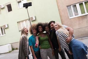 Group of friends taking picture of themselves photo