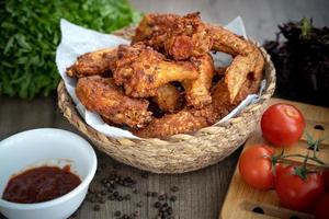 crispy fried chicken in the basket with salad photo
