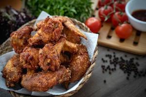 crispy fried chicken in the basket with salad photo