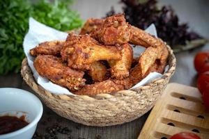 Breaded crispy fried kentucky chicken drumctick in the basket photo