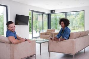 multiethnic couple in living room photo