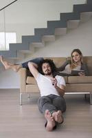 young couple relaxes in the living room photo