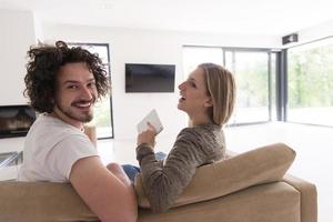 Rear view of couple watching television photo