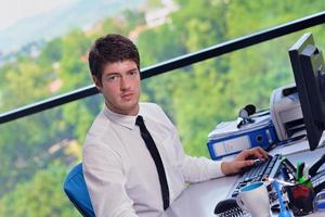 happy young business man at office photo