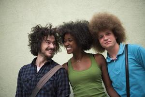 multiethnic group of happy three friends photo