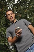 young casual man talking on cellphone photo