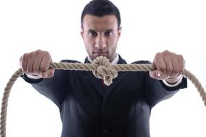 business man with rope isolated on white background photo