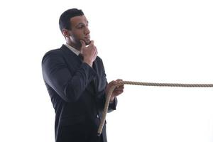 business man with rope isolated on white background photo