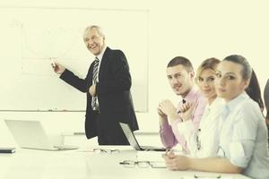 Senior business man giving a presentation photo