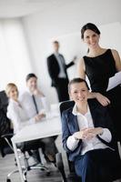 business woman with her staff in background photo