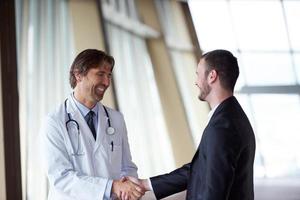 doctor handshake with a patient photo