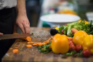 chef hands cutting carrots photo