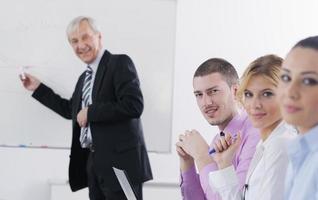 Senior business man giving a presentation photo