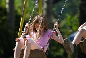 happy girl swinging photo