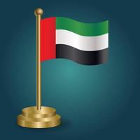 United Arab Emirates national flag on golden pole on gradation isolated dark background. table flag, vector illustration