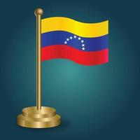 Venezuelan national flag on golden pole on gradation isolated dark background. table flag, vector illustration