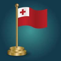 Tonga national flag on golden pole on gradation isolated dark background. table flag, vector illustration